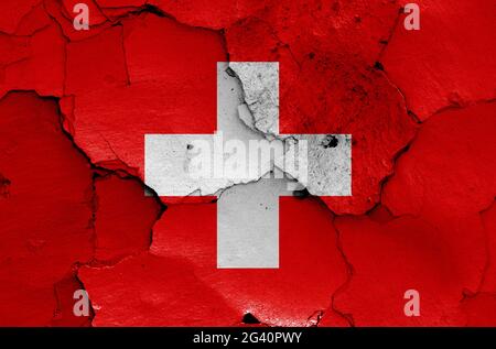 Flag of Switzerland painted on cracked wall Stock Photo