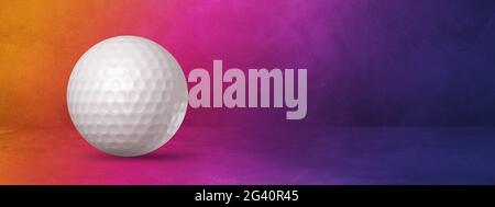 White golf ball on a purple gradient studio banner Stock Photo
