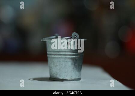 small iron bucket close-up on the table Stock Photo