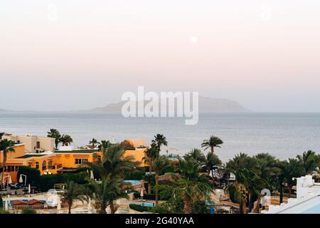 Panoramic view of sunny beach in tropical resort in Red Sea. Island in the middle of the sea Stock Photo