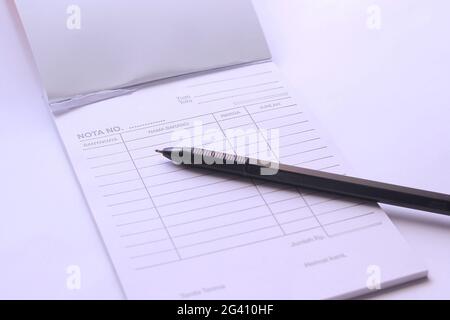 blank notes of purchase and ballpoint pens. the concept of counterfeiting in the purchase of an item Stock Photo