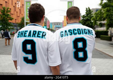 Wembley Stadium, London, UK. 18th June, 2021. 2021 European Football Championships, England versus Scotland; England fans outside Wembley Stadium wearing Euro 96 Alan Shearer and Paul Gascoigne England home shirts Credit: Action Plus Sports/Alamy Live News Stock Photo