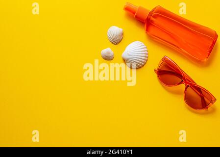 Flat lay photography of Summer items, glasses, sunscreen, seashells Stock Photo