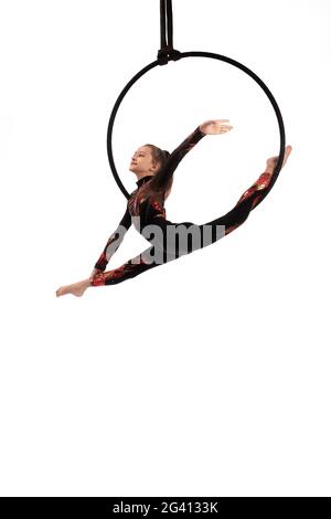 Aerial acrobat performing trick on hula hoop Stock Photo