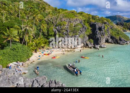 Aerial view of passengers of the cruise ship MV Reef Endeavor (Captain Cook Cruises Fiji) relaxing and enjoying water sports activities on Blue Lagoon Stock Photo
