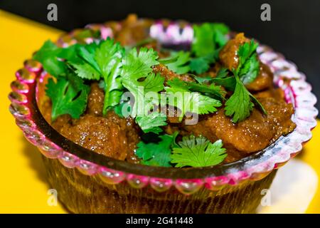 home made making spicy masala chicken in indian style close view  looking awesome in frying pan. Stock Photo
