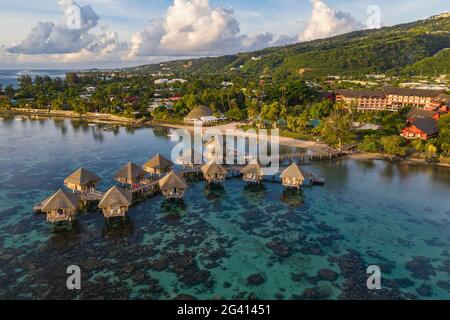 Aerial view of the Tahiti Ia Ora Beach Resort (managed by Sofitel) with overwater bungalows, near Papeete, Tahiti, Windward Islands, French Polynesia, Stock Photo