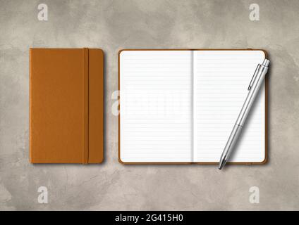 Leather closed and open lined notebooks with a pen on concrete background Stock Photo