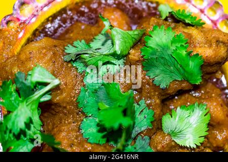 home made making spicy masala chicken in indian style close view  looking awesome in frying pan. Stock Photo