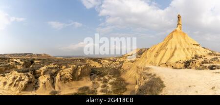 A panorama view of the Castildetierra cliff and desert grasslands in the Bardenas Reales desert in northern Spain Stock Photo