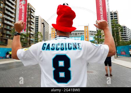 Wembley Stadium, London, UK. 18th June, 2021. 2021 European Football Championships, England versus Scotland; England fan wearing a Euro 96 Paul Gascoigne home England shirt outside Wembley Stadium Credit: Action Plus Sports/Alamy Live News Stock Photo