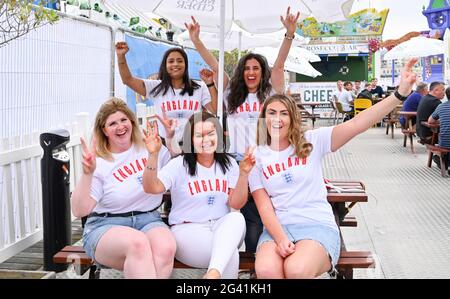 Brighton, UK.  18th June 2021 - England fans out in Brighton this evening ready for tonights match against Scotland in the UEFA European Championship  : Credit Simon Dack / Alamy Live News Stock Photo