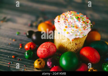 Close-up of Easter cake with Easter eggs on a wooden background. Stock Photo