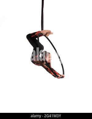 Aerial teen acrobat performing trick on hula hoop Stock Photo