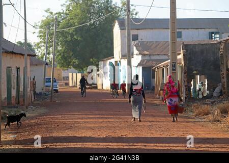 Gambia; Central River Region; Main street of Kuntaur; Street scene; Stock Photo