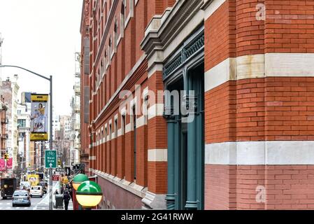 Brick wall building and street in New York City, USA, year 2019 Stock Photo