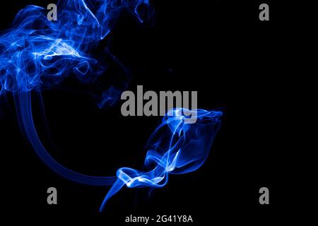 Blue smoke on black background Stock Photo