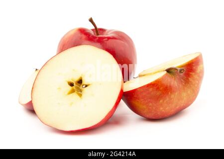 A whole and sliced red apple on a white background. Stock Photo