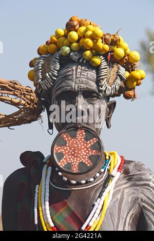 Ethiopia; Southern Nations Region; southern Ethiopian highlands; Mago National Park; lower Omo River; Mursi woman with lip plate and headdress Stock Photo