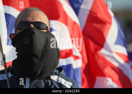People take part in a Loyalist protest in Newtownards, County Down, against the Northern Ireland Protocol. Picture date: Friday June 18, 2021. Stock Photo