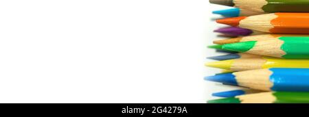 School color pencils banner on a white isolated background with copy space Stock Photo