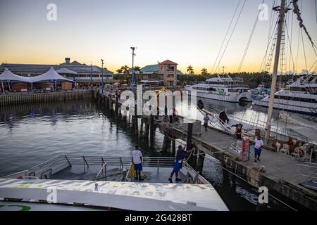 Catamaran Yasawa Flyer II (South Seas Cruises) docks in Port Denarau Marina, Port Denarau, near Nadi, Viti Levu, Fiji Islands, South Pacific at sunset Stock Photo