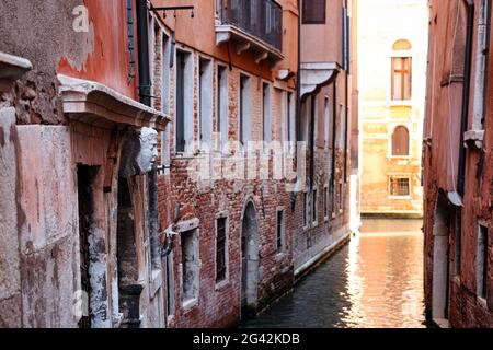 Detail shot of a carved face on a house facade in San Marco, Venice, Veneto, Italy, Europe Stock Photo