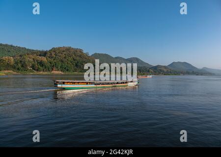 Tourist excursion boats on Mekong River, Luang Prabang, Luang Prabang Province, Laos, Asia Stock Photo