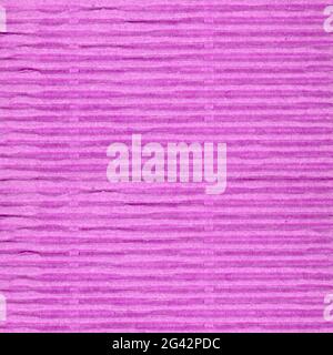 pink corrugated cardboard texture useful as a background Stock Photo
