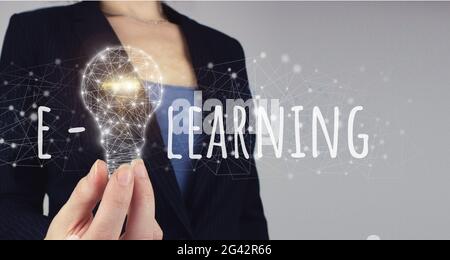 E-Learning Concept. E-learning Education Internet Online Courses concept. Hand hold digital light bulp. Idea of learning online. Stock Photo