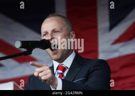 Loyalist blogger Jamie Bryson speaks at a Loyalist protest in Newtownards, County Down, against the Northern Ireland Protocol. Picture date: Friday June 18, 2021.