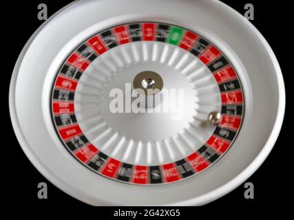 Casino roulette wheel isolated on Black background Stock Photo