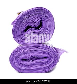 Skein of purple plastic trash bags with strings isolated on white background Stock Photo