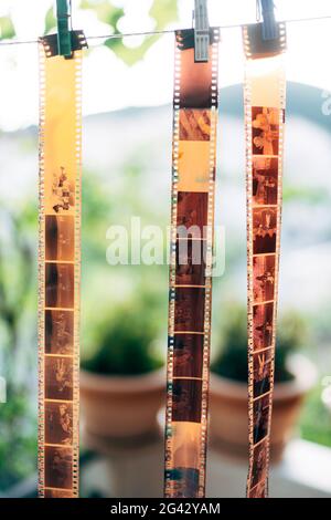 Budva, Montenegro - 21 august 2020: Old photographic film rolls, cassettes and retro cameras on the background. Old 35 mm negati Stock Photo