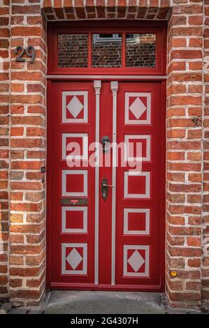 Old red door in the old town of Lueneburg, Germany Stock Photo