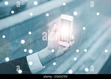 Businessman on blurred background using digital data network wit Stock Photo