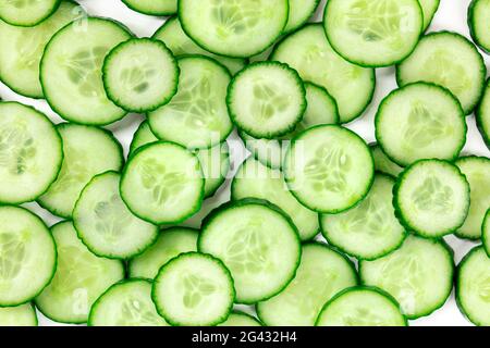 Cucumber background, overhead flat lay shot of cucumber slices Stock Photo