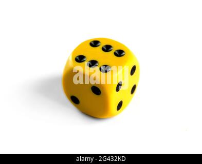 Yellow dice isolated on white background Stock Photo