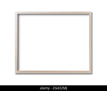 Wooden picture frame hanging on a white wall Stock Photo