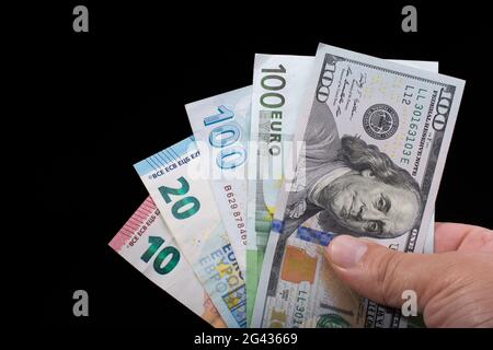 Hand holding American dollar  isolated on black background Stock Photo