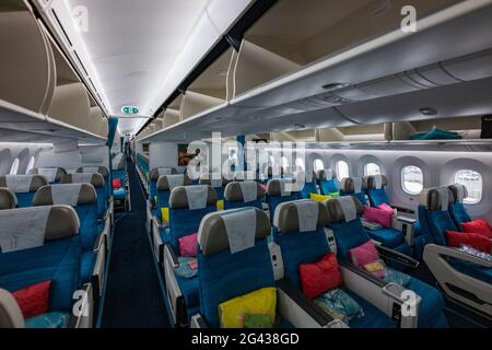 Colorful Moana Premium Economy Class cabin interior on board Air Tahiti Nui Boeing 787 Dreamliner aircraft, Paris Charles de Gaulle Airport (CDG), nea Stock Photo