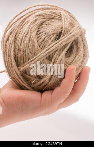Spools of thread in hand isolated on white background Stock Photo
