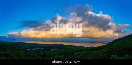 Cumulus clouds above Kealakekua Bay coast at sunrise, South Kona District, Hawaii, USA Stock Photo