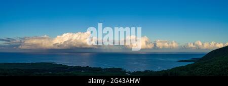 Cumulus clouds above Kealakekua Bay coast at sunrise, South Kona District, Hawaii, USA Stock Photo