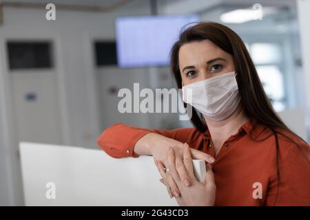 Call center operator in medical mask Stock Photo