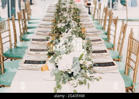 Wedding table setting decor with white flowers Stock Photo
