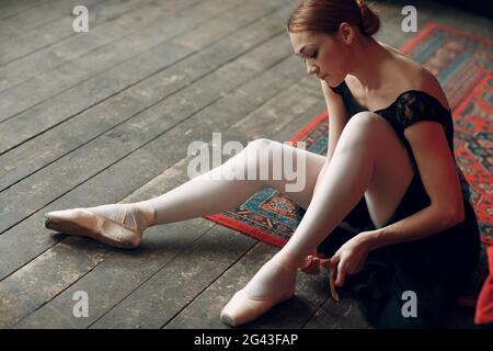 Ballerina. Young beautiful woman ballet dancer on stage. Stock Photo