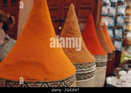 Bright multicolored red and orange spices in oriental bazaar. Stock Photo