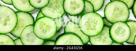 Cucumber panorama with many vibrant cucumber slices Stock Photo