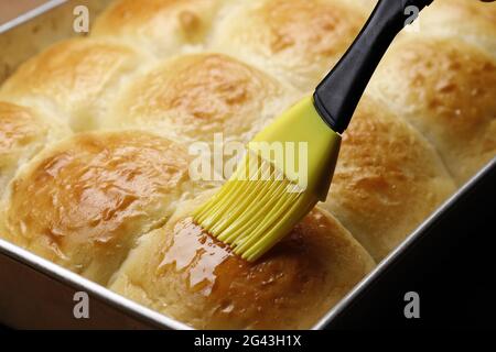 https://l450v.alamy.com/450v/2g43h1x/brushing-butter-on-rolls-2g43h1x.jpg